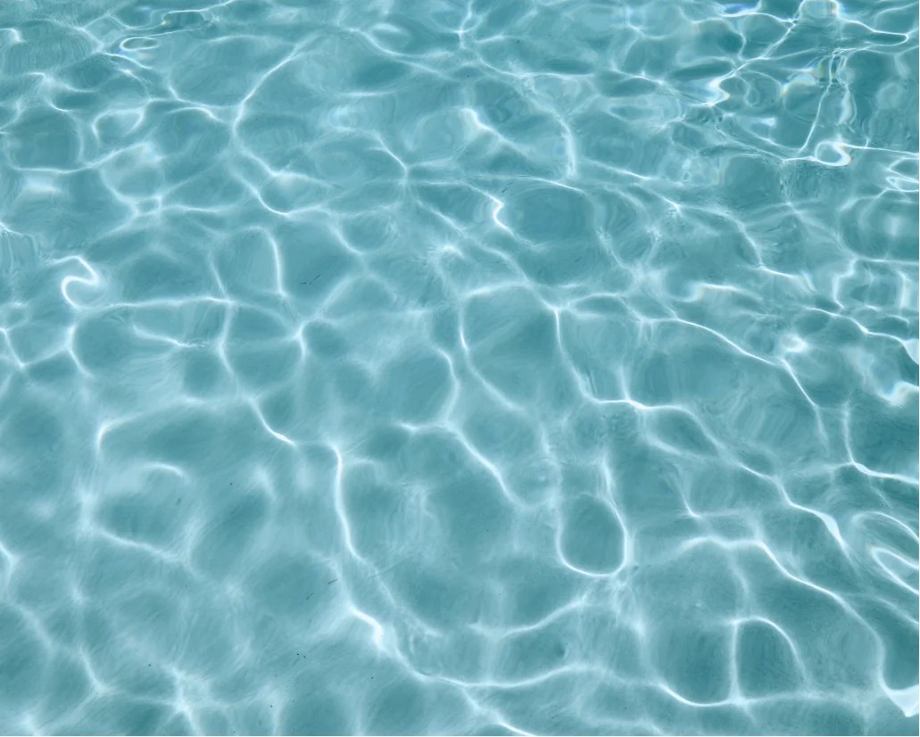 Sunlight moving across clear, calm water